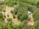 Expansive aerial view of wooded property with home and outbuilding at 197 Country Routt Brown Rd, Pittsboro, NC 27312