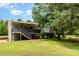 Expansive backyard featuring a covered deck area perfect for outdoor entertaining and relaxation at 197 Country Routt Brown Rd, Pittsboro, NC 27312