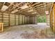 Interior of spacious barn with dirt floor and exposed beams at 197 Country Routt Brown Rd, Pittsboro, NC 27312