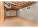Unfinished basement featuring concrete floor, partially finished walls, and exposed duct work at 197 Country Routt Brown Rd, Pittsboro, NC 27312
