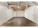 Unfinished basement with white walls, concrete floor and exposed ceiling at 197 Country Routt Brown Rd, Pittsboro, NC 27312