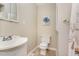 Cozy bathroom features a classic sink, toilet, and a shower with neutral tones at 197 Country Routt Brown Rd, Pittsboro, NC 27312