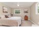 Relaxing bedroom featuring neutral decor, plush bedding, and a natural light from the window at 197 Country Routt Brown Rd, Pittsboro, NC 27312