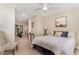 Comfortable bedroom with neutral tones, plush bedding, and access to an exercise area at 197 Country Routt Brown Rd, Pittsboro, NC 27312