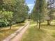 Long driveway leading to a secluded property at 197 Country Routt Brown Rd, Pittsboro, NC 27312