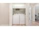 Laundry area featuring washer, dryer, storage cabinets and tiled floor at 197 Country Routt Brown Rd, Pittsboro, NC 27312