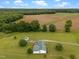 Sprawling property features a charming home, lush greenery, agricultural land, and serene wooded areas at 1993 Lucy Garrett Rd, Roxboro, NC 27574