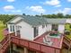 Elevated view of a backyard deck, complete with patio furniture and idyllic countryside views at 1993 Lucy Garrett Rd, Roxboro, NC 27574