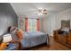 Cozy bedroom features natural light and a ceiling fan at 1993 Lucy Garrett Rd, Roxboro, NC 27574