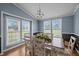 Sunlit dining room with a large table, seating for six, and scenic outdoor views at 1993 Lucy Garrett Rd, Roxboro, NC 27574