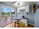Cozy eat-in kitchen with a breakfast table set by sliding glass doors to the deck at 1993 Lucy Garrett Rd, Roxboro, NC 27574