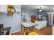 Cozy eat-in kitchen boasts stylish decor and an adjacent open-concept kitchen with modern appliances at 1993 Lucy Garrett Rd, Roxboro, NC 27574