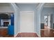 Entryway with open doorways leading to a living room and kitchen; features a closet with folding doors at 1993 Lucy Garrett Rd, Roxboro, NC 27574
