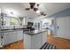Bright kitchen boasts white cabinets, a large island, and modern black appliances at 1993 Lucy Garrett Rd, Roxboro, NC 27574