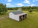 Large shed with open storage perfect for outdoor equipment and hobbies on a spacious lot at 1993 Lucy Garrett Rd, Roxboro, NC 27574