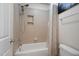 Clean bathroom featuring a shower-tub with a shower head and tile backsplash at 200 Vintage Hill Cir, Apex, NC 27539