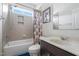 Bathroom with shower-tub, window and decorative shower curtain, offering a space for relaxation and convenience at 200 Vintage Hill Cir, Apex, NC 27539