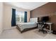 Bright bedroom featuring a large window, a bed, and a desk, perfect for relaxing and working from home at 200 Vintage Hill Cir, Apex, NC 27539