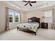 This bedroom offers natural light, plush carpeting, and a ceiling fan for added comfort at 200 Vintage Hill Cir, Apex, NC 27539