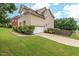 View of home showing a two car garage, landscaped yard and a driveway at 200 Vintage Hill Cir, Apex, NC 27539