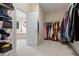 Large walk-in closet with built-in shelving and ample storage for clothes and accessories at 200 Vintage Hill Cir, Apex, NC 27539