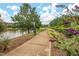 Enjoy a serene walk along the community walking path with lake views and lush landscaping at 200 Vintage Hill Cir, Apex, NC 27539