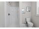 Bathroom featuring stand up shower, modern toilet, updated light fixture, and painted walls at 2003 Broadway Rd, Sanford, NC 27332