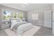 Bright bedroom featuring a large window, neutral color palette, and comfortable furnishings at 2003 Broadway Rd, Sanford, NC 27332