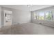 Bright bedroom featuring neutral paint, light wood flooring, and natural light from windows at 2003 Broadway Rd, Sanford, NC 27332