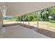 View of the covered patio with a concrete slab and views of the backyard at 2003 Broadway Rd, Sanford, NC 27332