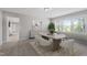 Bright dining room with modern table, six chairs, neutral colors, and lots of natural light at 2003 Broadway Rd, Sanford, NC 27332