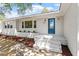 Charming brick home showcasing a bright blue front door, manicured landscaping and ample sunlight at 2003 Broadway Rd, Sanford, NC 27332