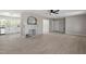 Living room featuring a ceiling fan, neutral paint, light wood flooring, and a decorative fireplace at 2003 Broadway Rd, Sanford, NC 27332