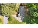 Aerial view of house and property showing the roof, trees, and driveway at 208 Essex Rd, Nashville, NC 27856