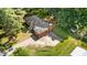 Charming single-story brick home featuring a large driveway and surrounded by mature trees at 208 Essex Rd, Nashville, NC 27856