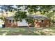 Brick house back exterior showing a white vinyl addition and large windows at 208 Essex Rd, Nashville, NC 27856