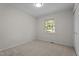 Neutral bedroom featuring a window, carpet flooring, and ample natural light at 208 Essex Rd, Nashville, NC 27856