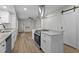 Updated kitchen with granite countertops, stainless appliances, eat-in bar, and views into living room at 208 Essex Rd, Nashville, NC 27856
