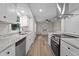 Modern kitchen features granite countertops, stainless steel appliances, and updated fixtures at 208 Essex Rd, Nashville, NC 27856