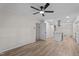 Open-concept living room flowing into kitchen with stainless steel appliances at 208 Essex Rd, Nashville, NC 27856