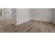 Bright living room features modern vinyl flooring, fresh paint, and ample natural light at 208 Essex Rd, Nashville, NC 27856