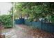 The backyard features a lush landscaped yard, a beautiful wooden fence and charming brick path for relaxing in nature at 2236 The Cir, Raleigh, NC 27608