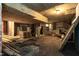 A basement with a brick wall, concrete beams, and lots of construction and demolition materials at 2236 The Cir, Raleigh, NC 27608