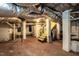 Spacious basement with exposed ductwork, painted brick, and stairs at 2236 The Cir, Raleigh, NC 27608