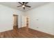 Bedroom with hardwood floors and multiple entryways at 2236 The Cir, Raleigh, NC 27608