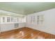 Spacious bedroom with built-in shelves and large windows with shutters at 2236 The Cir, Raleigh, NC 27608