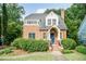 Beautiful brick home featuring a classic design, well-maintained landscaping, and inviting entrance at 2236 The Cir, Raleigh, NC 27608