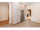 Well-equipped kitchen with white cabinets, stainless steel refrigerator, and tile flooring at 2236 The Cir, Raleigh, NC 27608