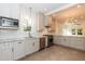 Modern kitchen with stainless steel appliances, gray cabinets, and granite countertops at 2236 The Cir, Raleigh, NC 27608