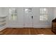 Cozy living room featuring natural light, hardwood floors and built-in shelves at 2236 The Cir, Raleigh, NC 27608